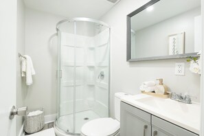 Shower, hair dryer, towels, soap