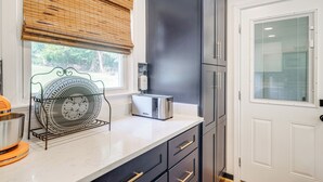 A kitchen with a toaster, a dish rack, and a window with blinds. - 2 Mi to Potomac Mills: Modern Home in Woodbridge (Woodbridge)