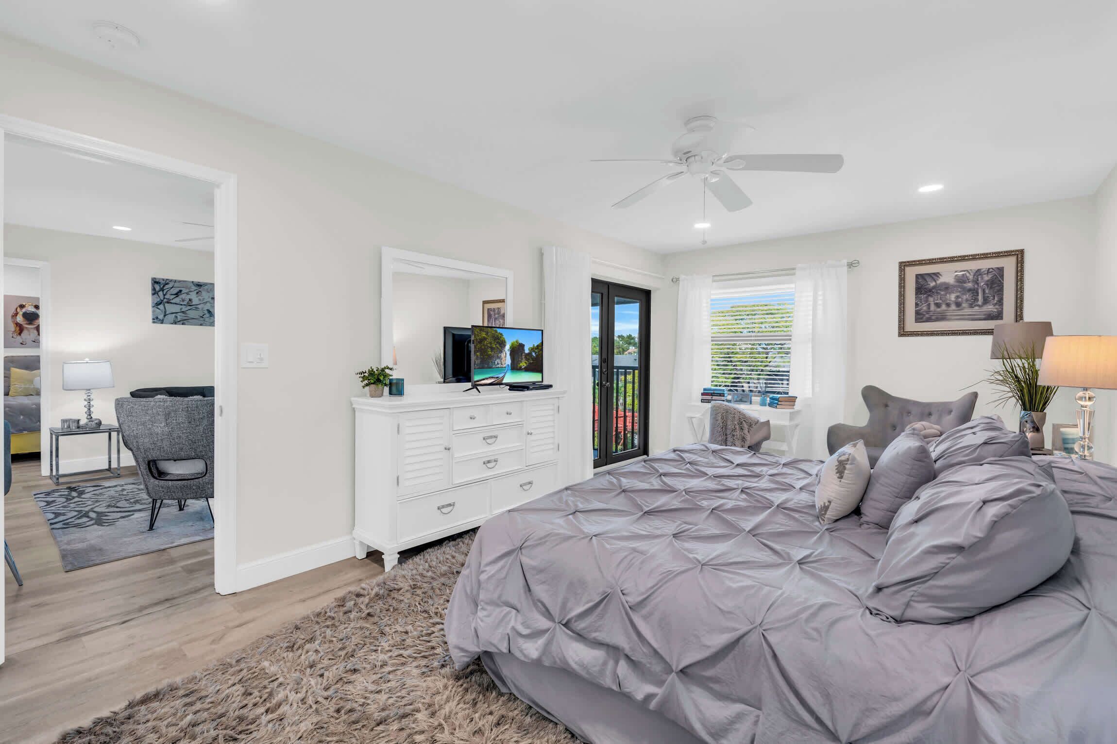 There is a King bed in the main bedroom along with a TV and a fan for added comfort 