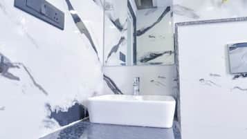 Deluxe Room, City View | Bathroom | Shower, slippers, towels, soap