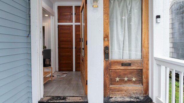 A wooden front door with a nameplate, a small porch with a bench, and a wooden door with a curtain. - Fully Stocked Kitchen,  AC,  Wi-Fi, W/D,  Near Baseball and Walk to Downtown (Oneonta)