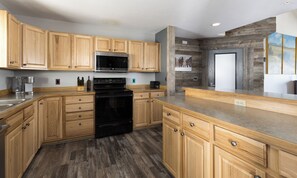 Fridge, microwave, oven, stovetop - Big Sky Vacation Rentals | Spotted Fawn Court (Big Sky MT)