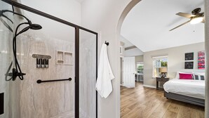 A modern bathroom with a glass shower door, a towel rack, and a ceiling fan. - 30+ Night Stay! Beautiful Property - Spa, Views, LRG Patio! (Temecula)
