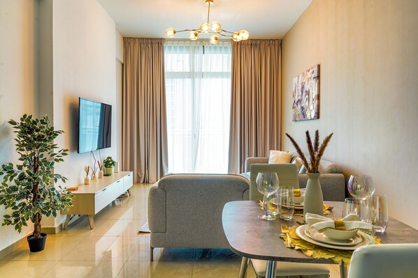 Comfort Apartment, Balcony | Living area | 55-inch Smart TV with cable channels - Nasma Holiday Homes - Frankfurt Sports Tower (Dubai)