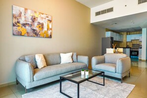 Comfort Apartment, Balcony | Living area | 55-inch Smart TV with cable channels - Nasma Holiday Homes - Frankfurt Sports Tower (Dubai)