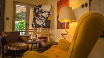 Economy Room, Balcony, City View | Living area | Flat-screen TV