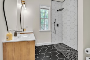 Shower, hair dryer, towels, soap