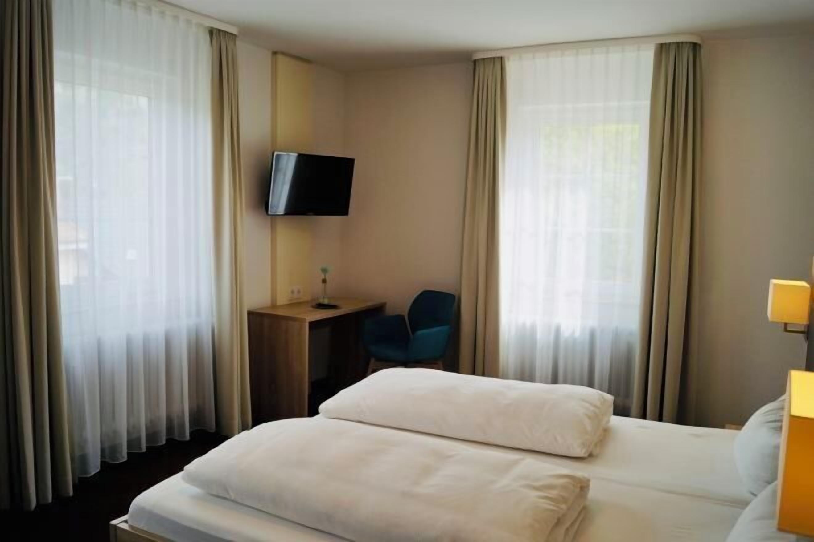 Desk, laptop workspace, free WiFi, bed sheets