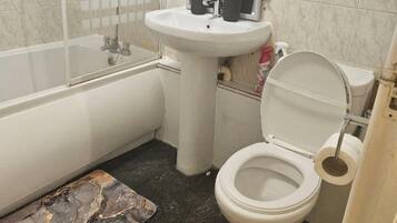 Separate bathtub and shower, deep-soaking bathtub, towels