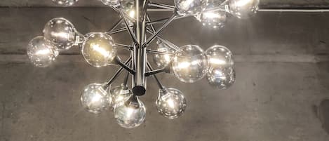 A chandelier with multiple spherical glass bulbs.