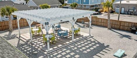 A covered patio area with outdoor seating.