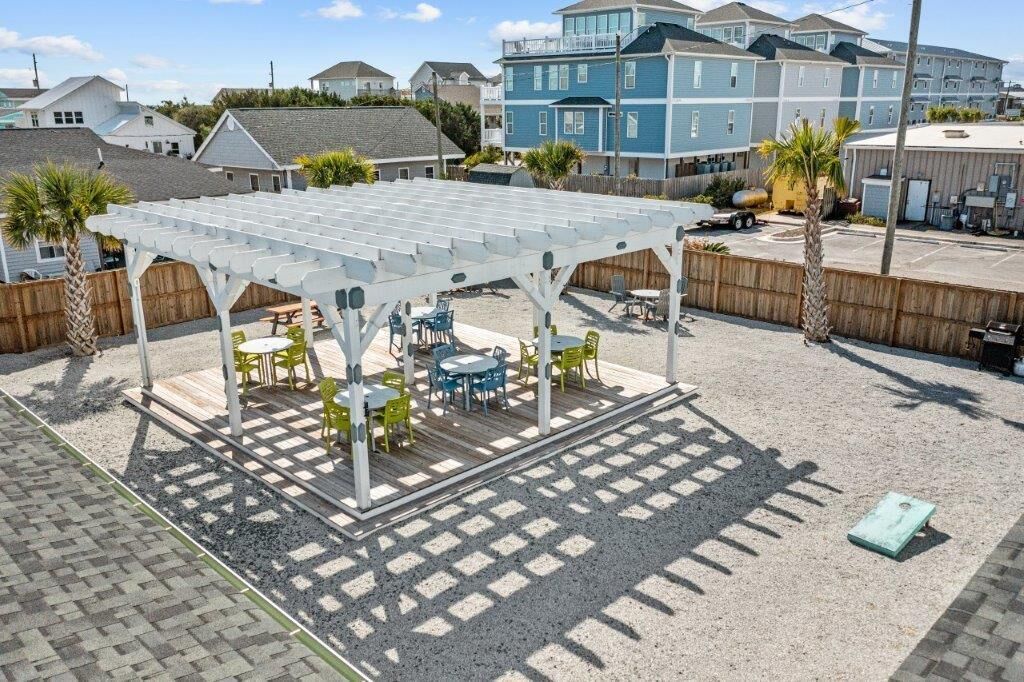 A covered patio area with outdoor seating.