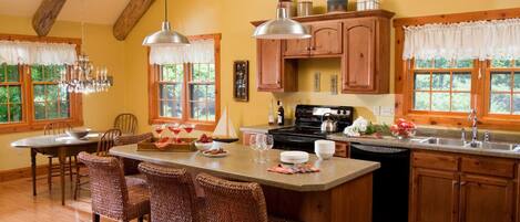 Fridge, dishwasher, coffee/tea maker, cookware/dishes/utensils