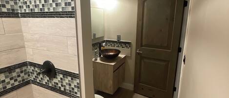 A bathroom with a bathtub, a sink, and a toilet.