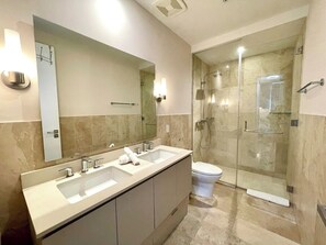 Shower, hair dryer, towels, soap