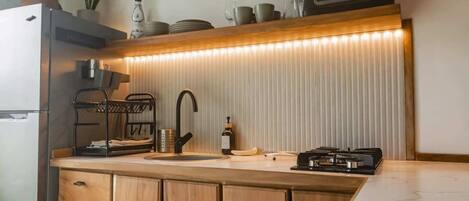 Fridge, stovetop, coffee/tea maker, cookware/dishes/utensils