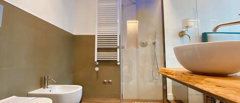 Shower, eco-friendly toiletries, hair dryer, bidet