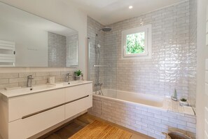 Shower, hair dryer, towels, soap