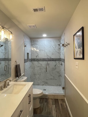 Shower, hair dryer, towels, soap