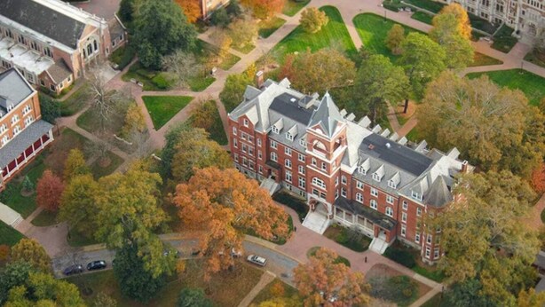 An aerial view of a large, historic building with a symmetrical facade, surrounded by well-maintained gardens and a clear road network. - Cozy King bed and Queen Sofa bed Apt (Decatur)
