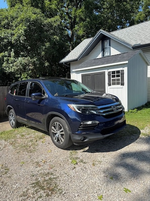 A blue SUV parked in front of a white building with a garage. -
Two Bedroom Cottage House in Uptown Westerville (Westerville)