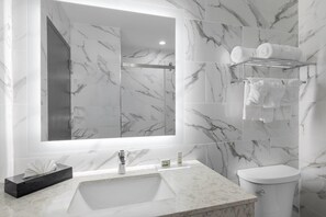 Room, 1 King Bed, Non Smoking | Bathroom | Shower, rainfall showerhead, free toiletries, hair dryer