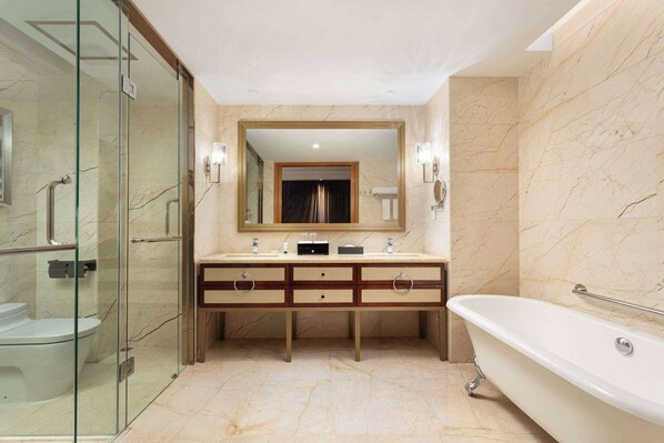 A modern bathroom with a glass-enclosed shower, a freestanding bathtub, and a vanity with two sinks. - Wyndham Kunming Anning Hot Spring Resort (Kunming)