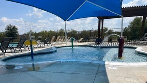 A pool area with lounge chairs and umbrellas. - PGA HQ Area, Sleeps 10, King-Size Beds for Groups (Little Elm)