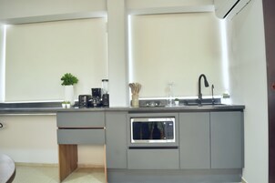 Mini-fridge, microwave, stovetop, coffee/tea maker