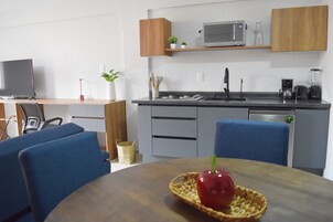 Family Apartment, City View | Private kitchen | Mini-fridge, microwave, stovetop, coffee/tea maker