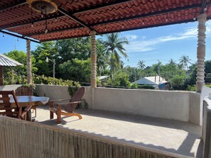 Relax in a serene outdoor space with a patio area featuring a table and chairs.