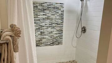 Shower, hair dryer, towels, soap