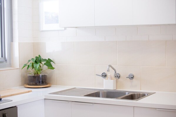 Microwave, oven, cookware/dishes/utensils, dining tables