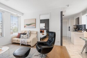 A modern apartment with a living room, bedroom, and kitchen. - The Red Ember Retreat (Caulfield North)