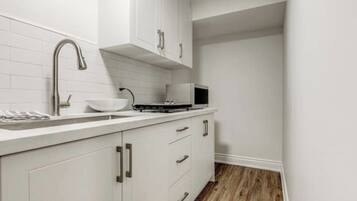 Fridge, microwave, electric kettle, cookware/dishes/utensils