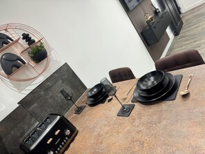 Enjoy a sophisticated dining experience with a beautifully set table and access to music.