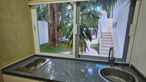 Apartment, Pool View | Private kitchen | Mini-fridge, microwave, stovetop, cookware/dishes/utensils - SAYU - Suites (Cozumel)