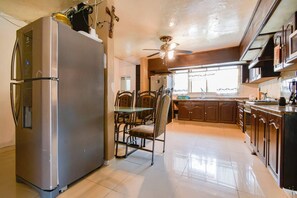 Fridge, microwave, blender, cookware/dishes/utensils