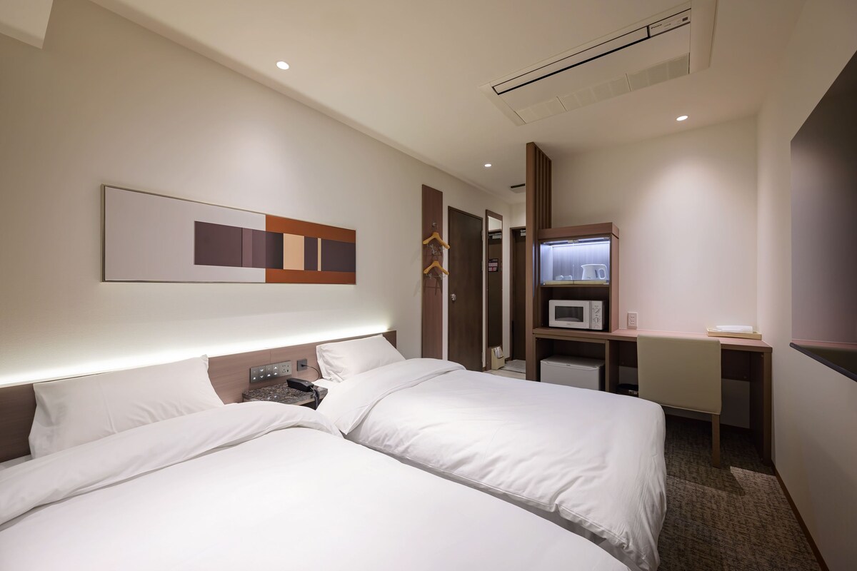 Chambre Standard avec lits jumeaux | Rideaux occultants, Wi-Fi gratuit, draps fournis