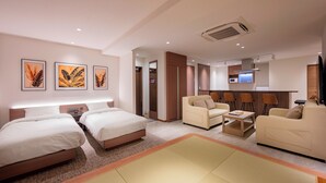 A hotel room with two beds, a sofa, a small table, and a TV. - COCOYO HOTEL Otsuka (Tokyo)