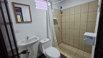 Basic Quadruple Room | Bathroom | Shower, towels, soap, toilet paper