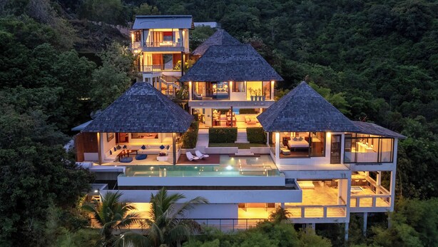 A multi-level resort with a swimming pool, multiple bedrooms, and a lush forest backdrop. -  Jasmine Waterslide Villa (Koh Samui)