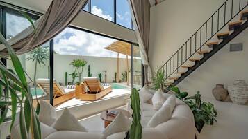 Villa, Multiple Beds, Pool View | Living area | 55-inch Smart TV with cable channels, smart speakers