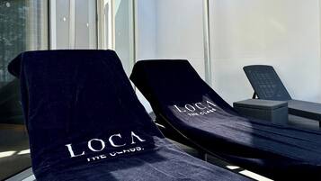 Relax in style with two comfortable lounge chairs on the outdoor patio.
