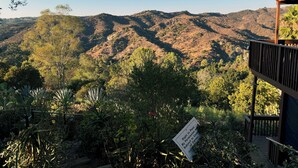 A view of a mountainous landscape with a wooden deck and a sign indicating private property. - Spacious 3-bedroom/ 2 bath apartment in Topanga Hills with AC (Topanga)