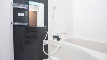 Separate bathtub and shower, hair dryer, towels, shampoo