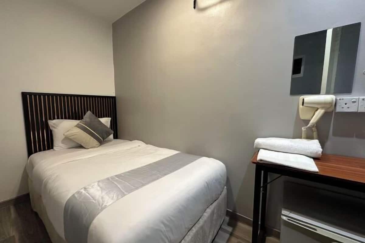 Lakens van Egyptisch katoen, luxe beddengoed, een minibar, een bureau