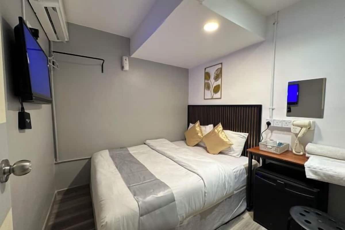 Lakens van Egyptisch katoen, luxe beddengoed, een minibar, een bureau