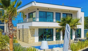 A modern two-story house with a swimming pool, stone walls, and large windows. - Primosten Hills West - Branded Luxury Villa (Primošten)