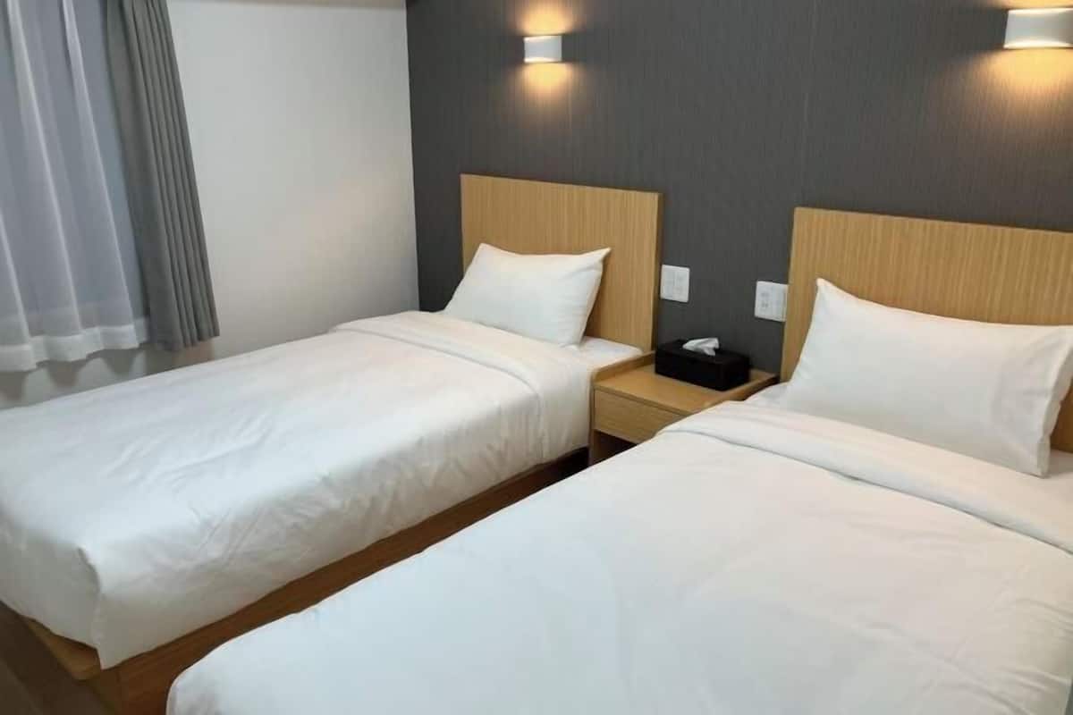 Premium bedding, laptop workspace, blackout drapes